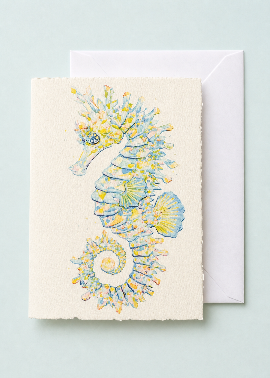 Opal the Seahorse 5x7 deckled-edge greeting card showing blue, gold, and opalescent seahorse with a white envelope